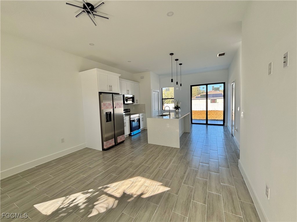 3010 45th Street Southwest Lehigh Acres, FL 33976 - Photo 12 of 29 a view of a kitchen with a sink and a window