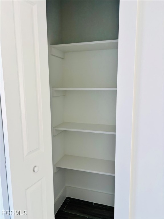 3010 45th Street Southwest Lehigh Acres, FL 33976 - Photo 13 of 29 a view of walk in closet with empty racks