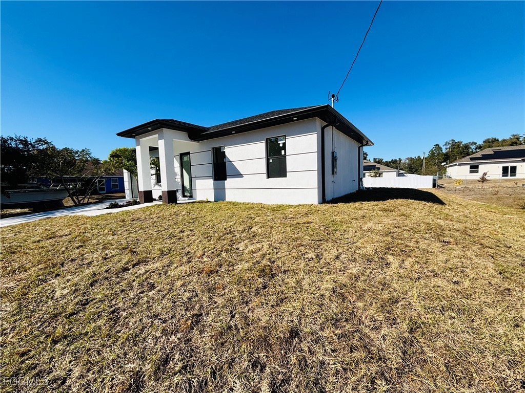 3010 45th Street Southwest Lehigh Acres, FL 33976 - Photo 29 of 29 a house view with a outdoor space