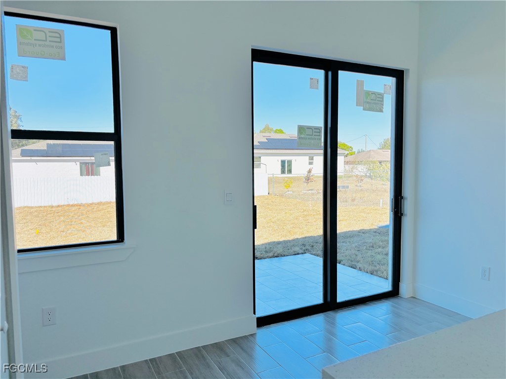 3010 45th Street Southwest Lehigh Acres, FL 33976 - Photo 10 of 29 a view of front door with wooden floor