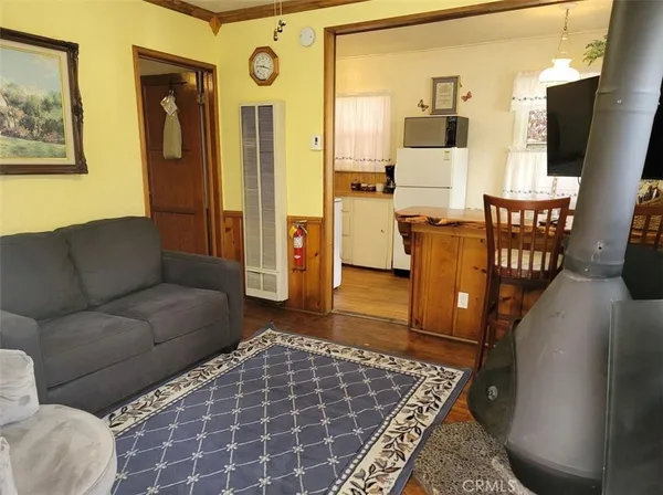 a living room with furniture and a rug