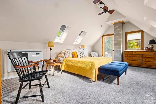 a bedroom with a bed and a dresser in it