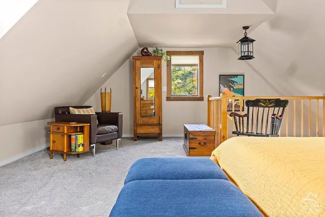 a bedroom with furniture and a chandelier