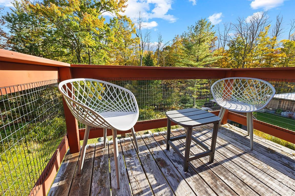 214 Fog Hill Road Austerlitz, NY 12017 - Photo 25 of 38 a view of balcony with wooden floor and outdoor seating