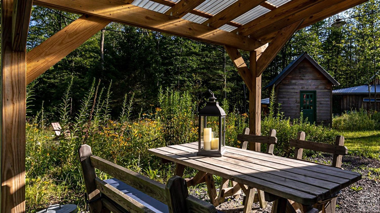 214 Fog Hill Road Austerlitz, NY 12017 - Photo 32 of 38 a view of a patio with table and chairs and potted plants