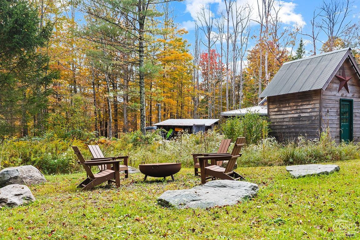214 Fog Hill Road Austerlitz, NY 12017 - Photo 33 of 38 a backyard of a house with table and chairs