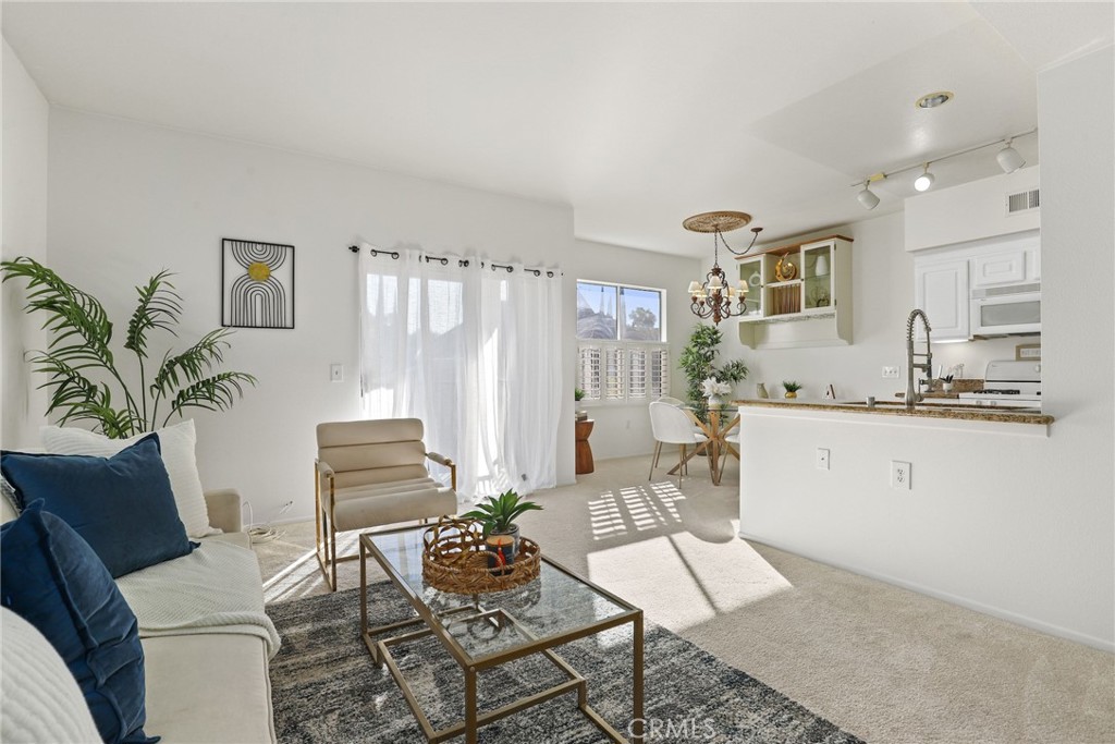 20000 Plum Canyon Road, Unit 221 Saugus, CA 91350 - Photo 1 of 30 a living room with furniture and wooden floor