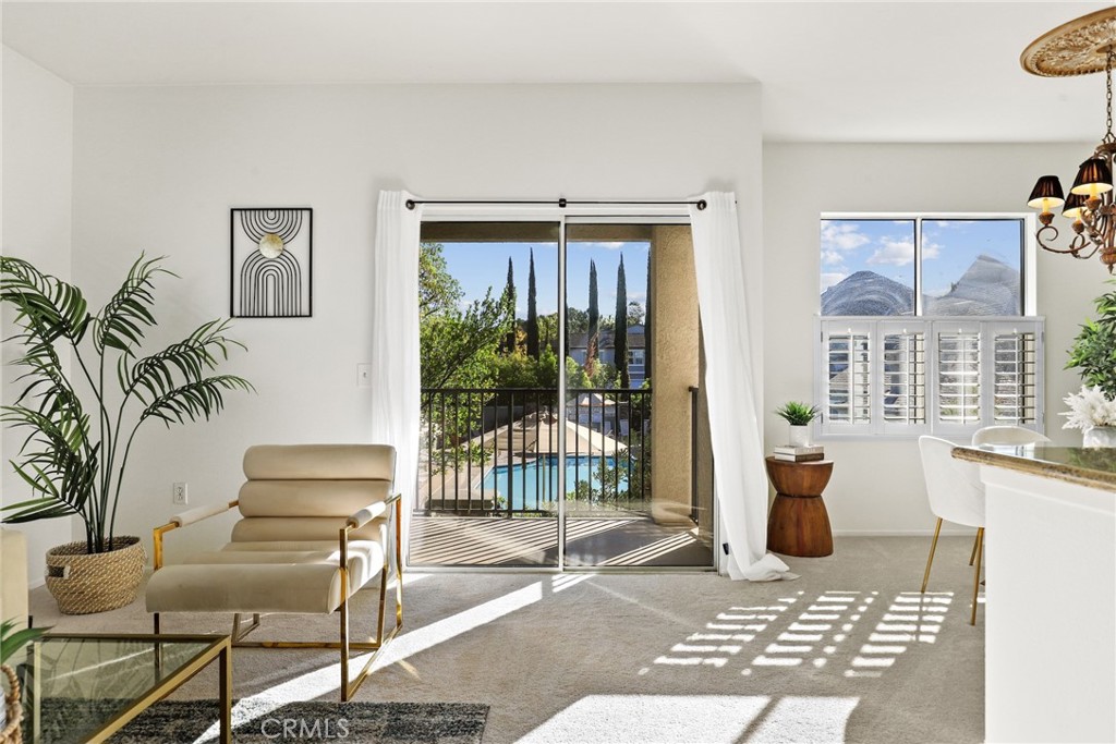 20000 Plum Canyon Road, Unit 221 Saugus, CA 91350 - Photo 14 of 30 a living room with furniture and a window