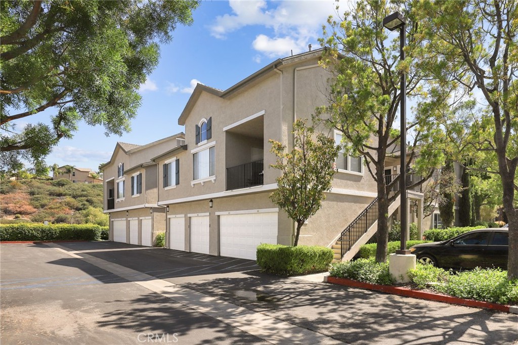 20000 Plum Canyon Road, Unit 221 Saugus, CA 91350 - Photo 19 of 30 a view of street along with house and trees