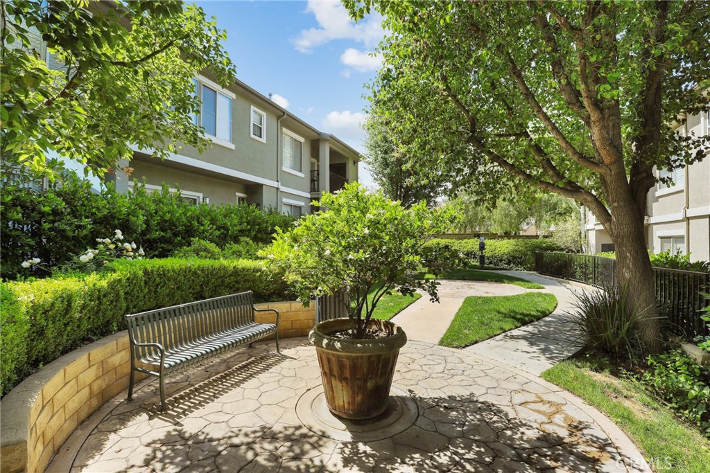 20000 Plum Canyon Road, Unit 221 Saugus, CA 91350 - Photo 29 of 30 a front view of a house with a garden
