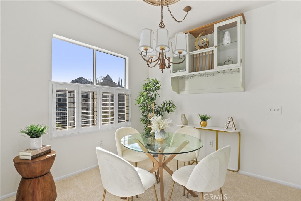 20000 Plum Canyon Road, Unit 221 Saugus, CA 91350 - Photo 4 of 30 a table and chairs in a room