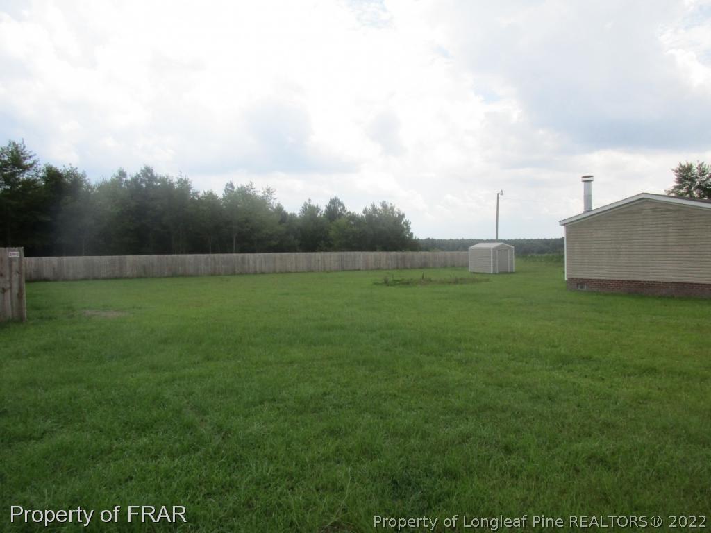 794 Wiggins Road Clinton, NC 28328 - Photo 17 of 18 a view of an outdoor space and a yard