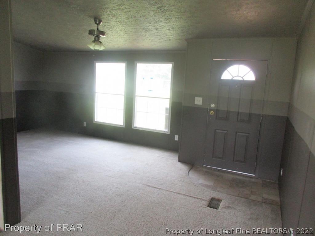 794 Wiggins Road Clinton, NC 28328 - Photo 3 of 18 a view of livingroom with window