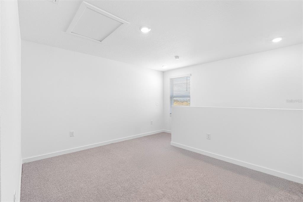 15147 Canvasback Road Brooksville, FL 34614 - Photo 6 of 9 an empty room with a empty space and window