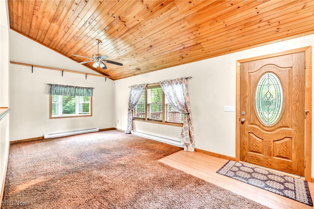 6081 Laskey Road Rome, OH 44085 - Photo 5 of 25 Entryway with wooden ceiling, vaulted ceiling, baseboard heating, and ceiling fan