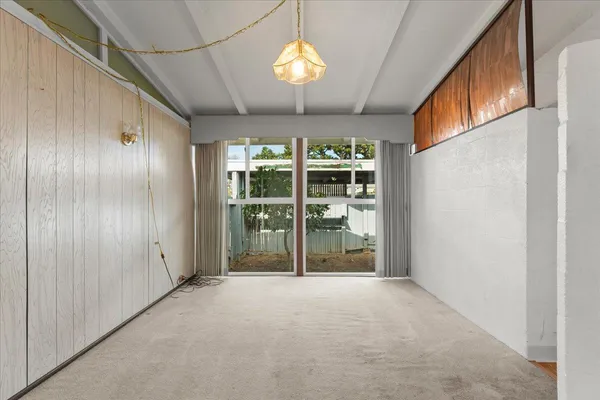 a view of empty room with windows