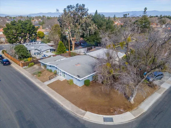 an aerial view of a house with outdoor space