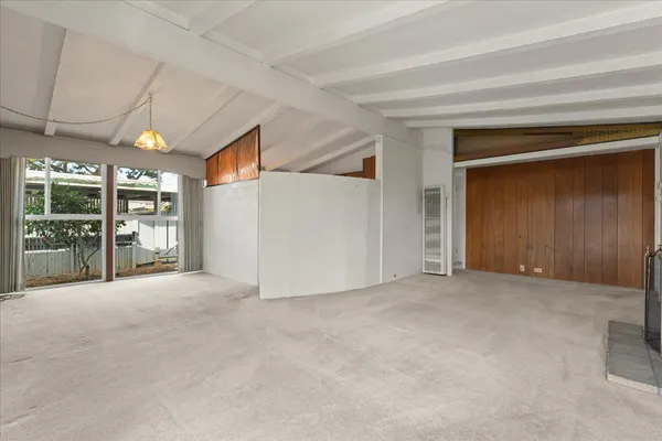 a view of an empty room with a garage