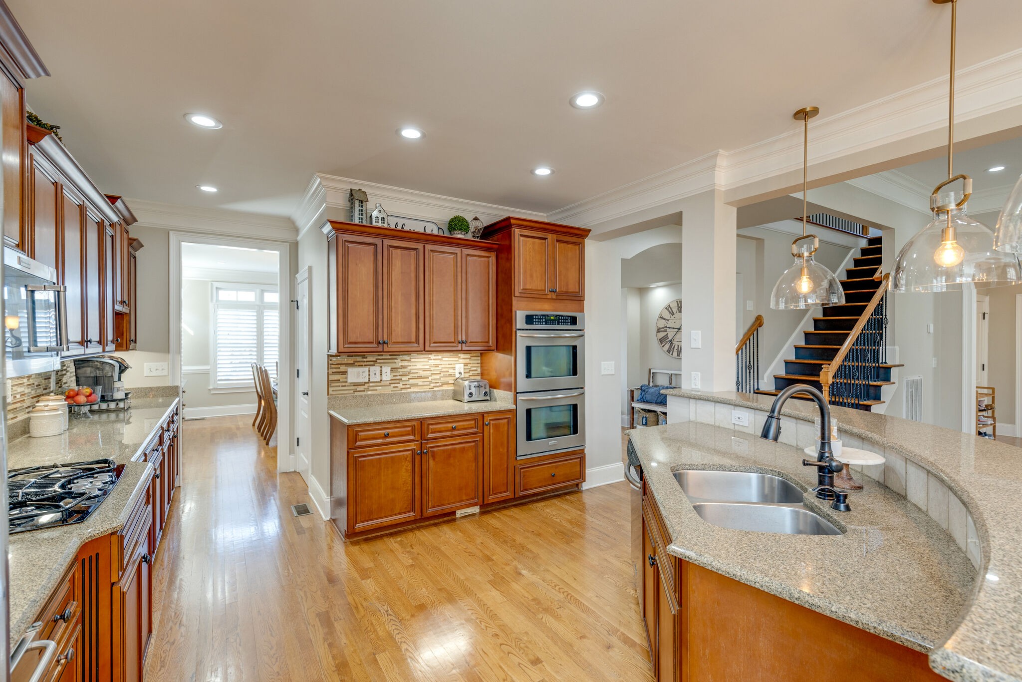3207 Appian Way Spring Hill, TN 37174 - Photo 8 of 27 a kitchen with stainless steel appliances granite countertop a sink stove and refrigerator