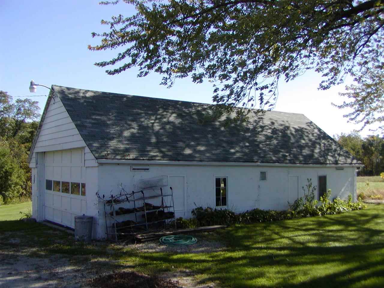 4991 South Ridge Road Oregon, IL 61061 - Photo 2 of 15 front view of house with a yard