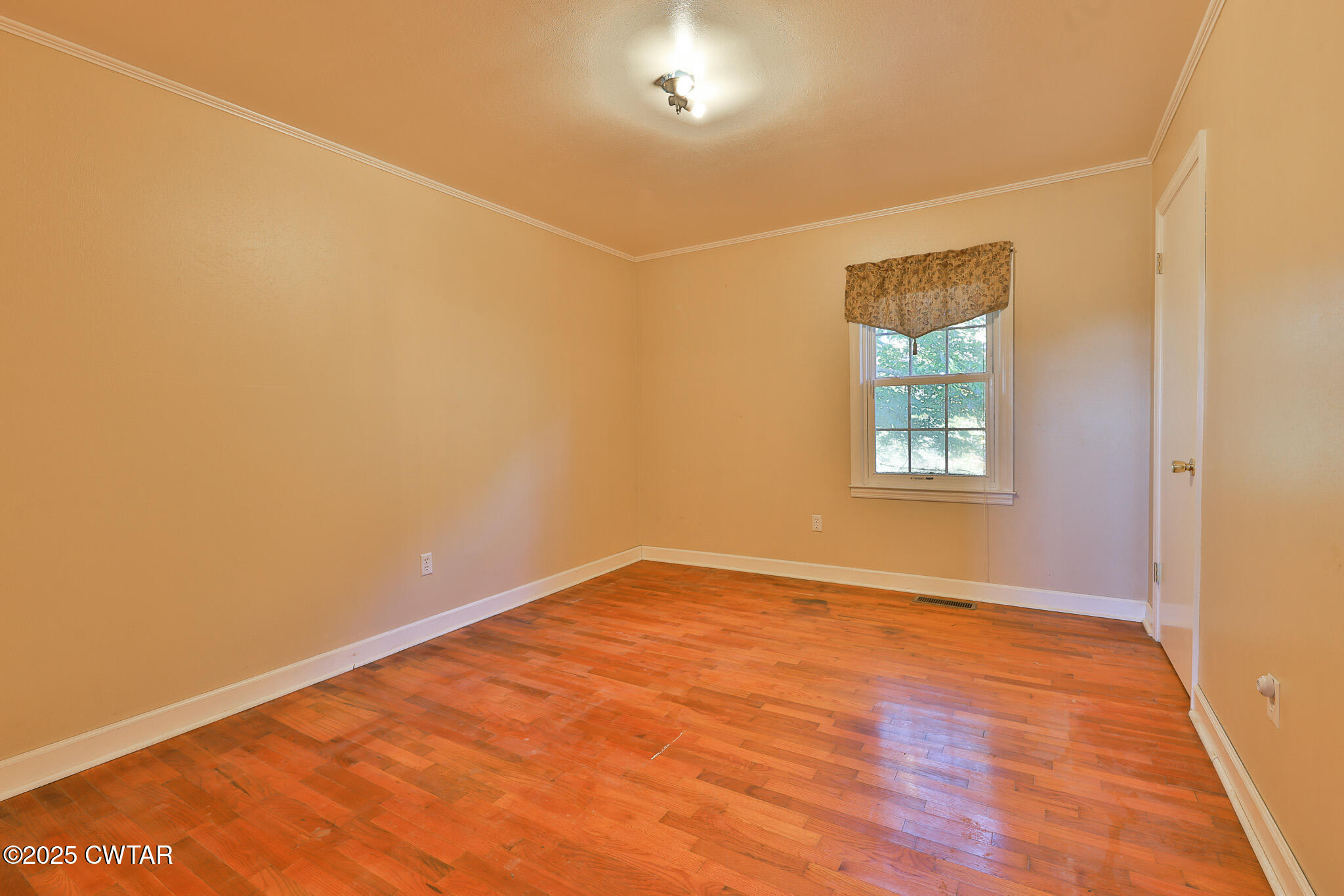 4030 Shades Bridge Road Greenfield, TN 38230 - Photo 11 of 27 an empty room with windows