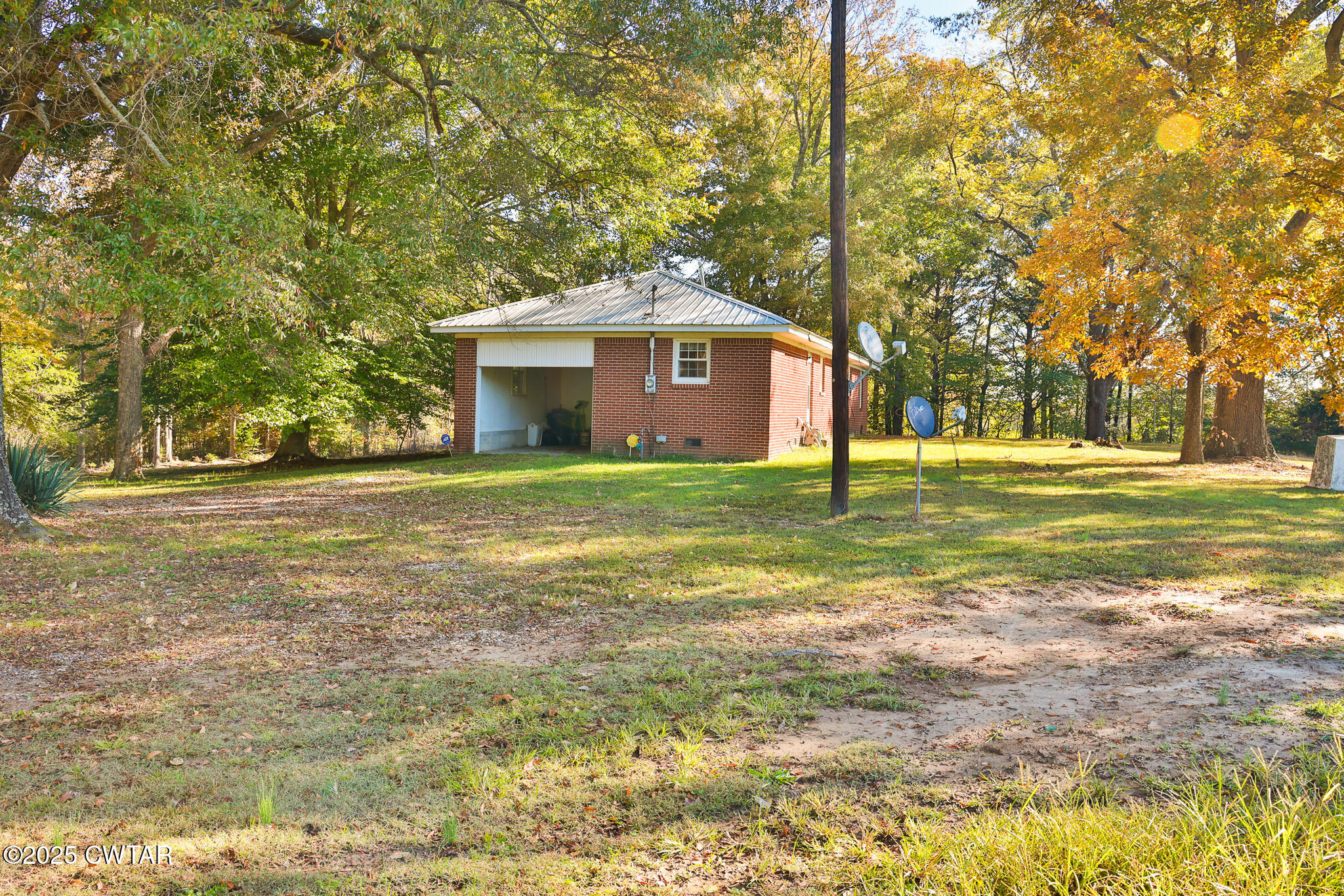 4030 Shades Bridge Road Greenfield, TN 38230 - Photo 20 of 27 a big house with a big yard and large trees