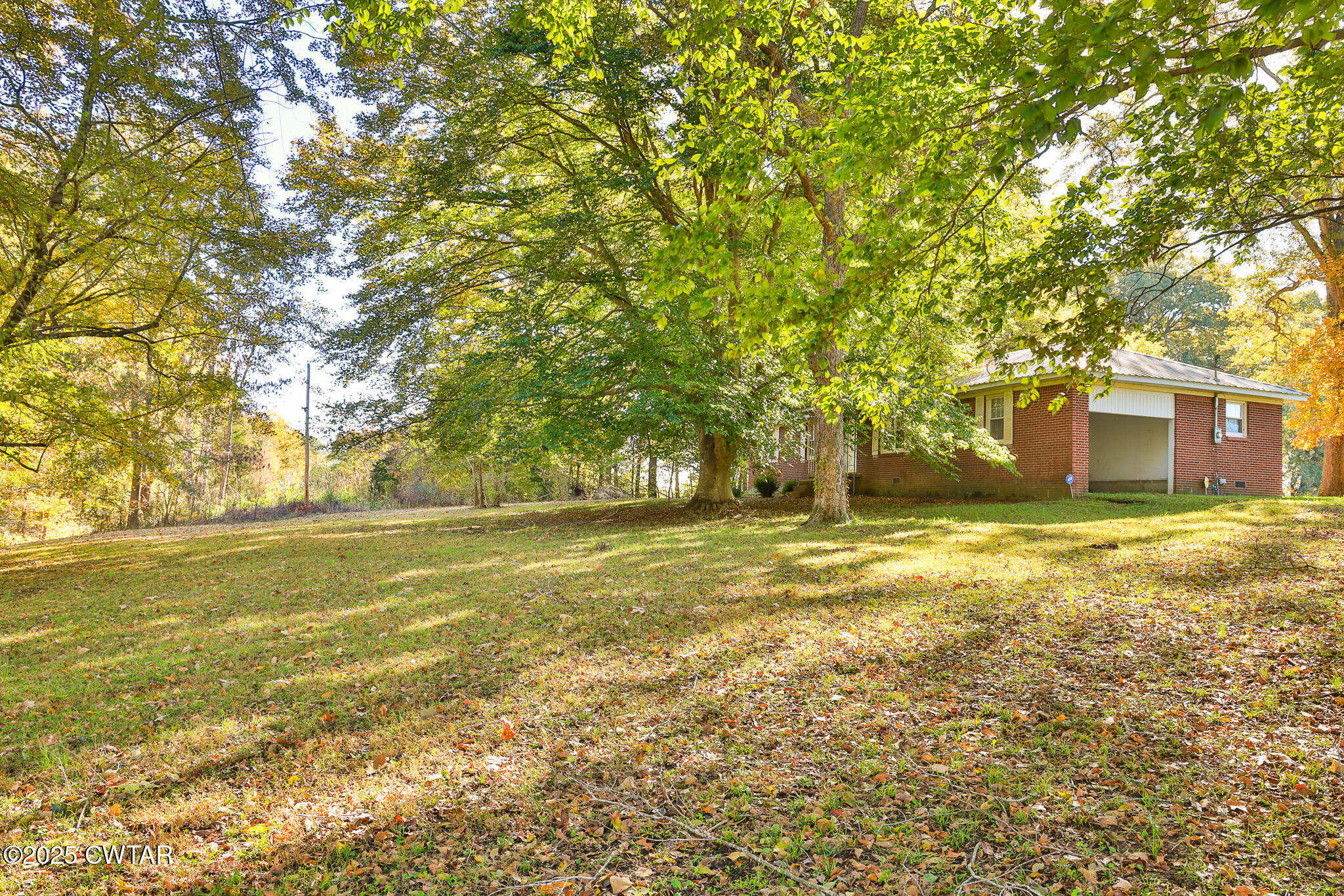 4030 Shades Bridge Road Greenfield, TN 38230 - Photo 23 of 27 a view of a house with a yard