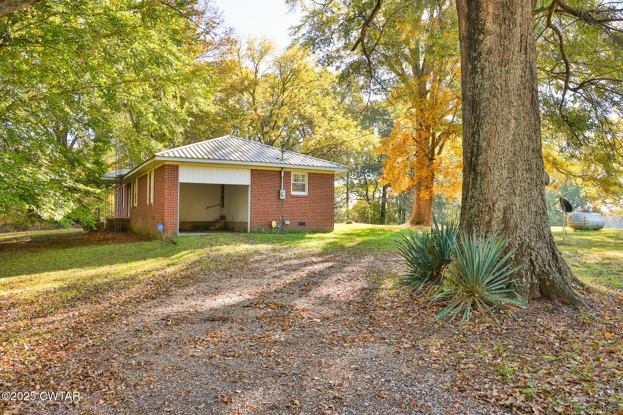 4030 Shades Bridge Road Greenfield, TN 38230 - Photo 24 of 27 a front view of house with yard and green space