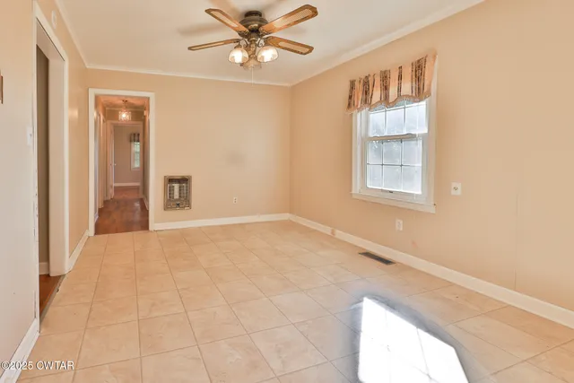 a view of an empty room with a window