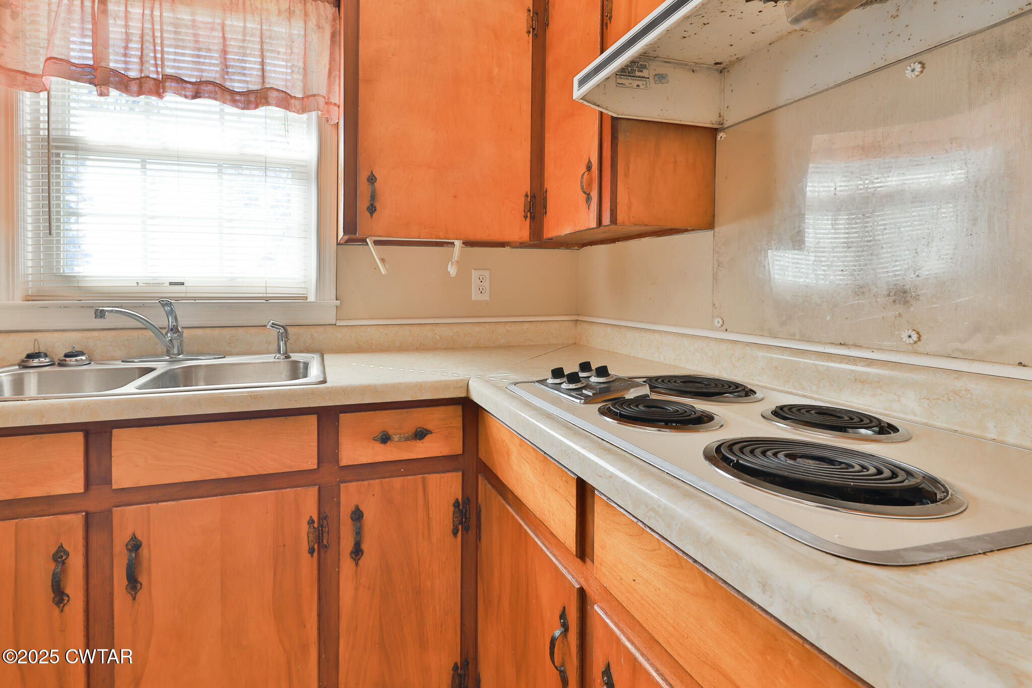 4030 Shades Bridge Road Greenfield, TN 38230 - Photo 8 of 27 a kitchen with a sink a stove and a window