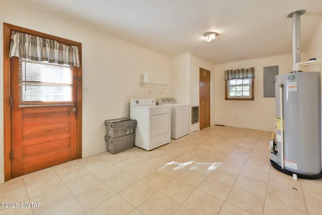 a room with furniture and a refrigerator