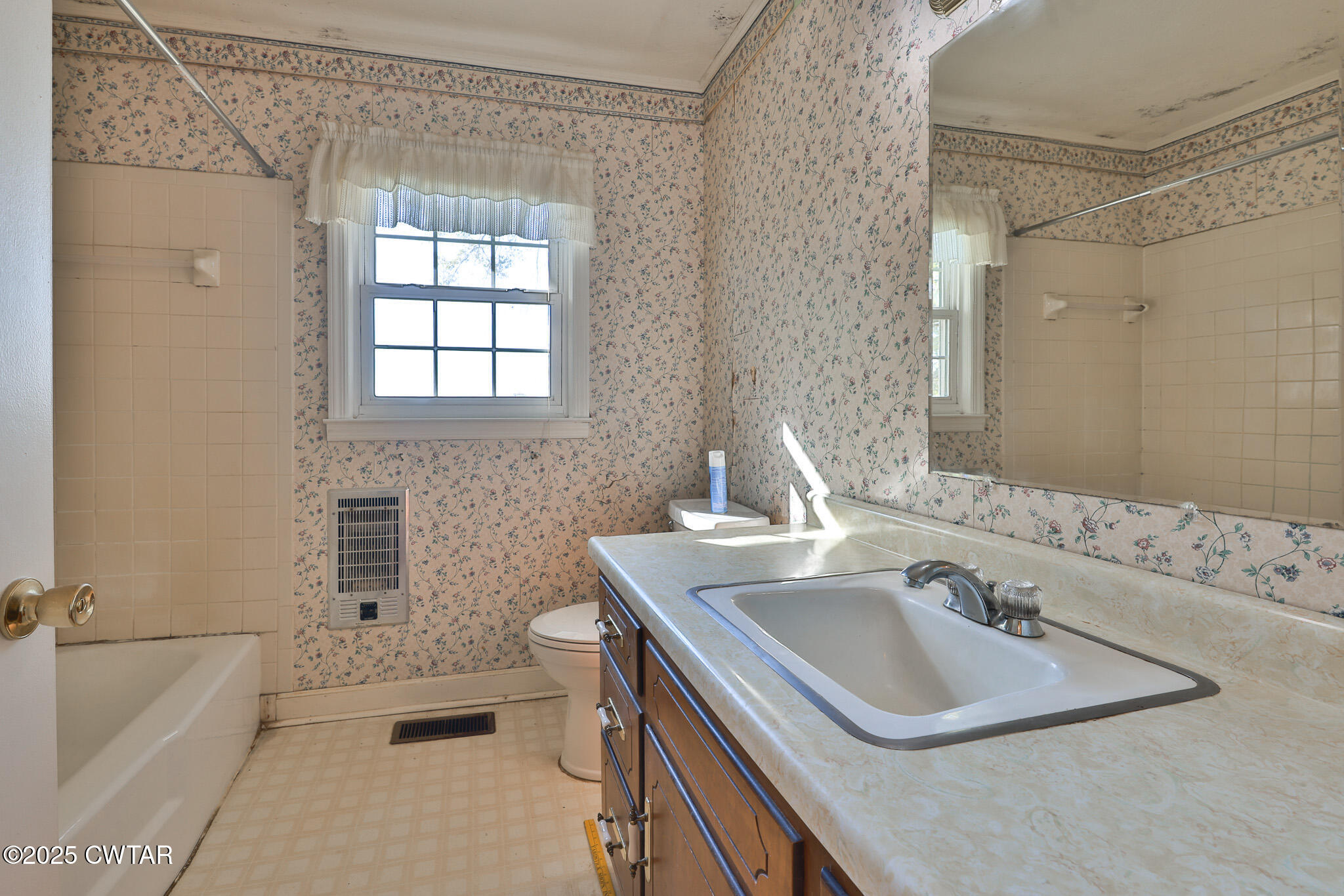 4030 Shades Bridge Road Greenfield, TN 38230 - Photo 10 of 27 a bathroom with a sink and a bathtub