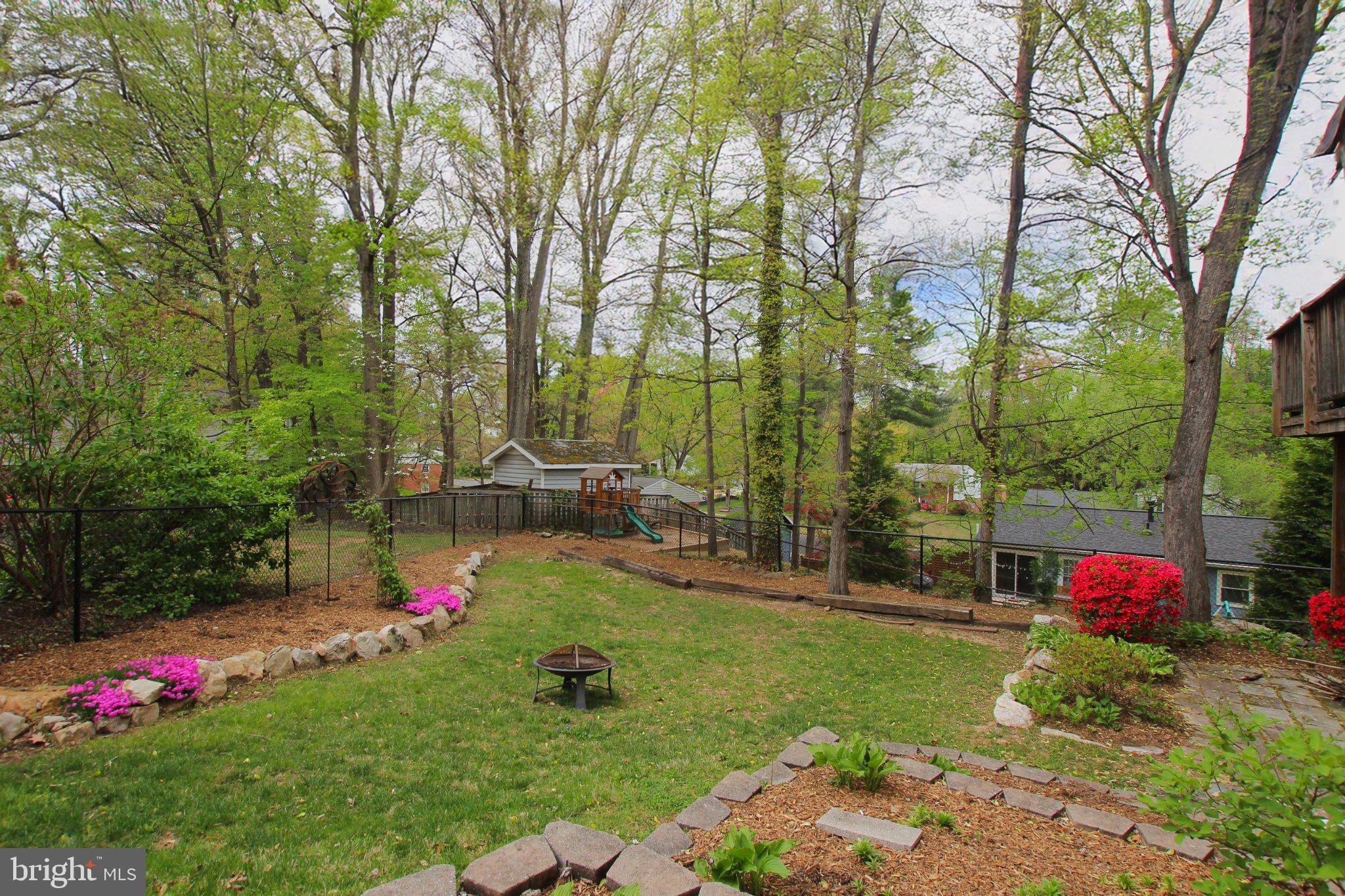 8502 Ivybridge Court Springfield, VA 22152 - Photo 13 of 31 a view of backyard with table and chairs and potted plants