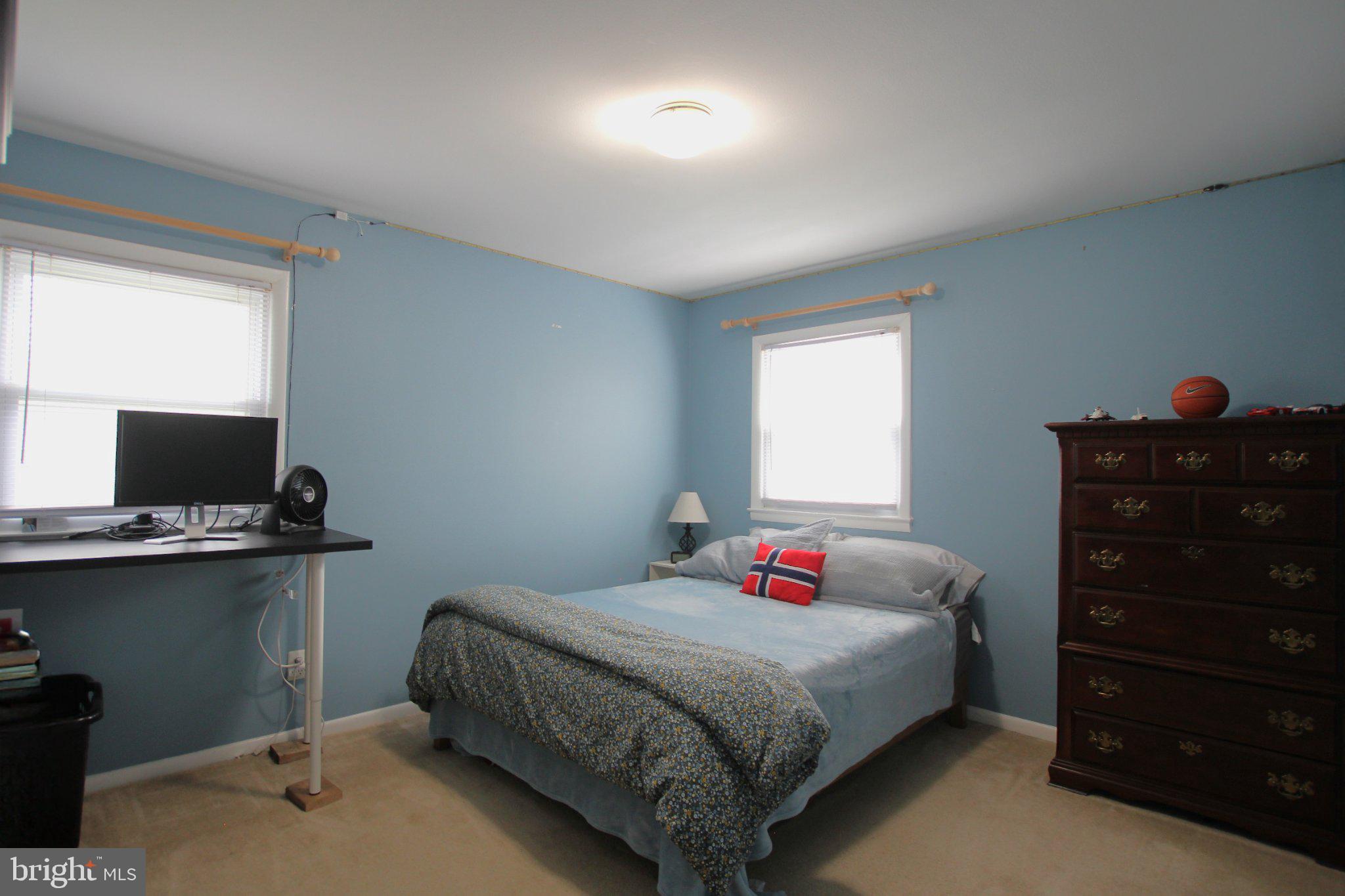 8502 Ivybridge Court Springfield, VA 22152 - Photo 16 of 31 a bedroom with a bed and a dresser