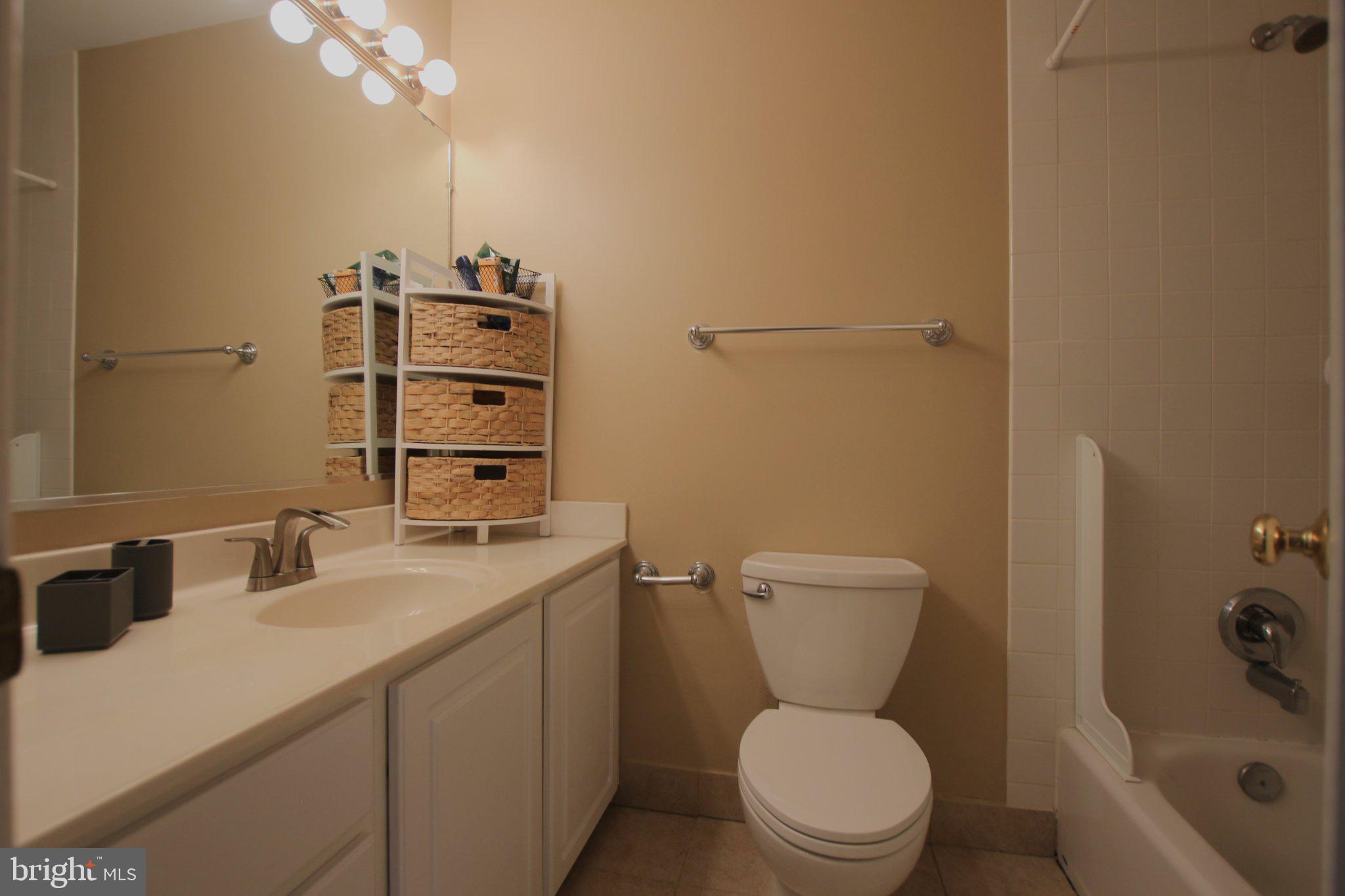 8502 Ivybridge Court Springfield, VA 22152 - Photo 18 of 31 a bathroom with a sink a toilet and shower