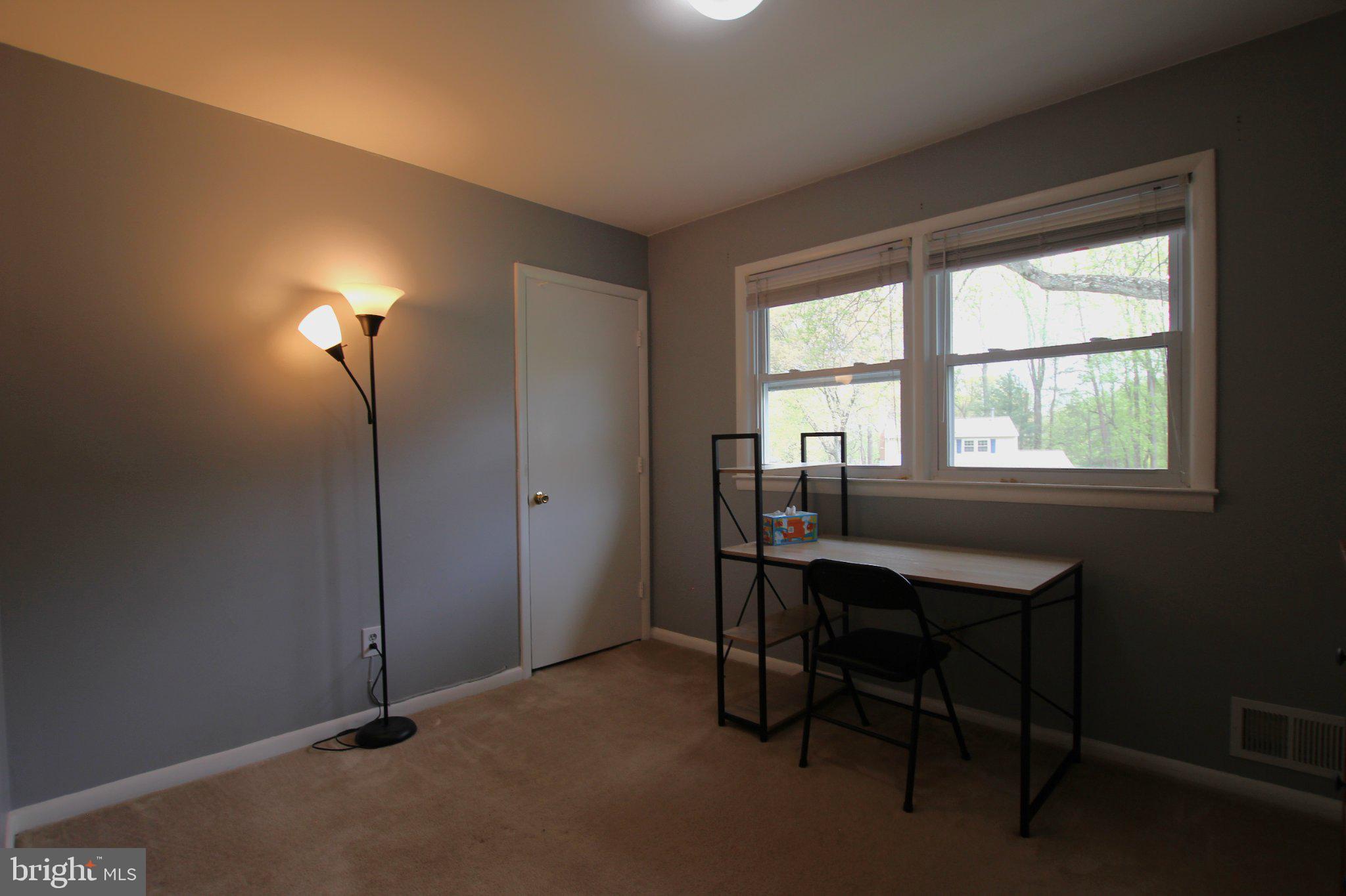 8502 Ivybridge Court Springfield, VA 22152 - Photo 22 of 31 a view of a workspace with furniture and a window