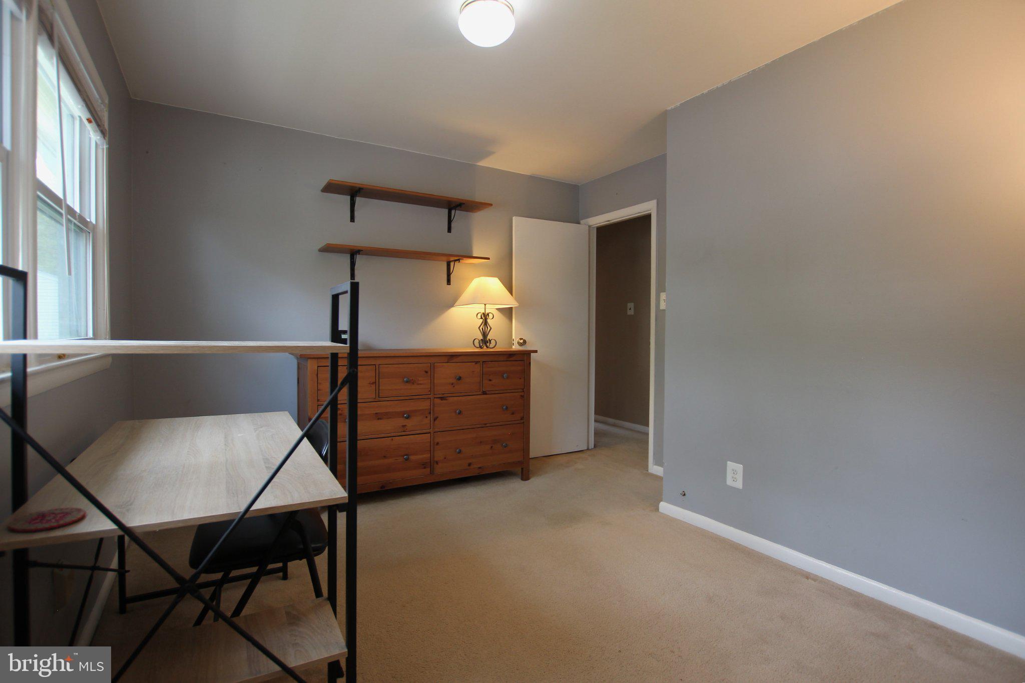 8502 Ivybridge Court Springfield, VA 22152 - Photo 23 of 31 a view of a room with furniture and wooden floor