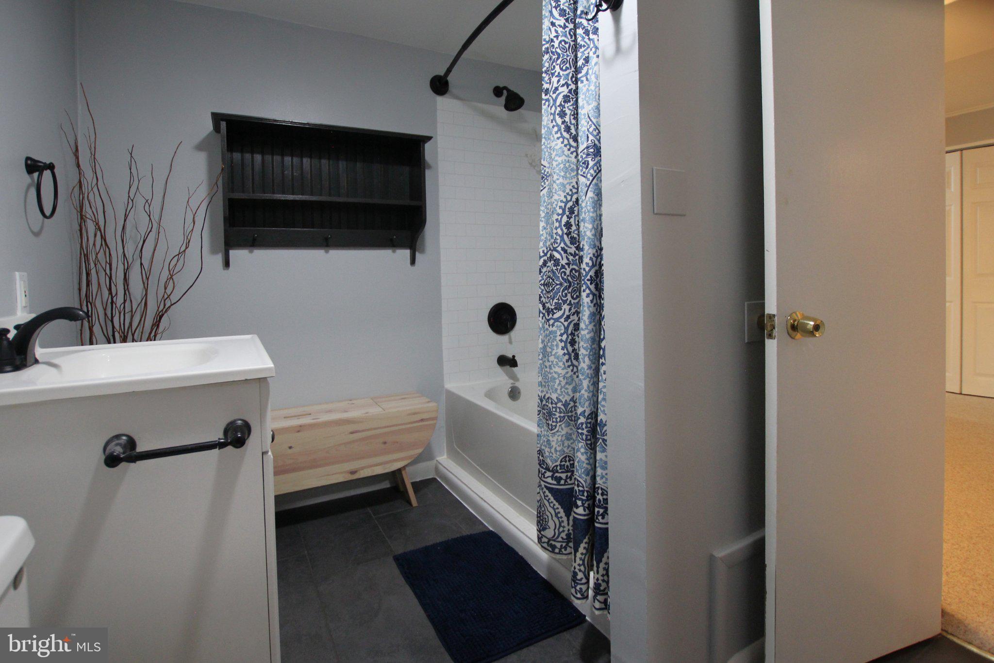 8502 Ivybridge Court Springfield, VA 22152 - Photo 27 of 31 a bathroom with a sink a toilet and shower