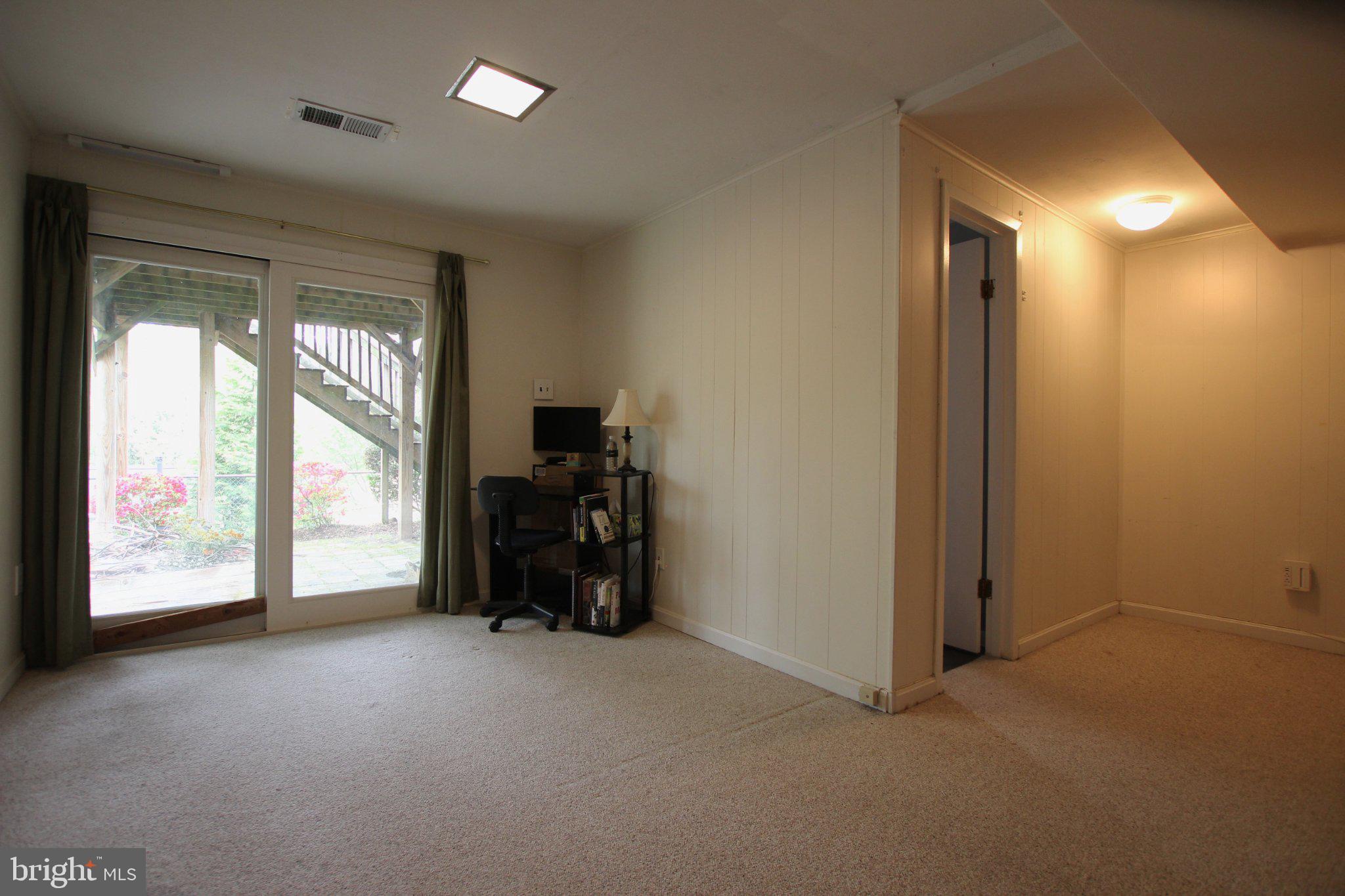 8502 Ivybridge Court Springfield, VA 22152 - Photo 28 of 31 a view of a big room with furniture and a large window