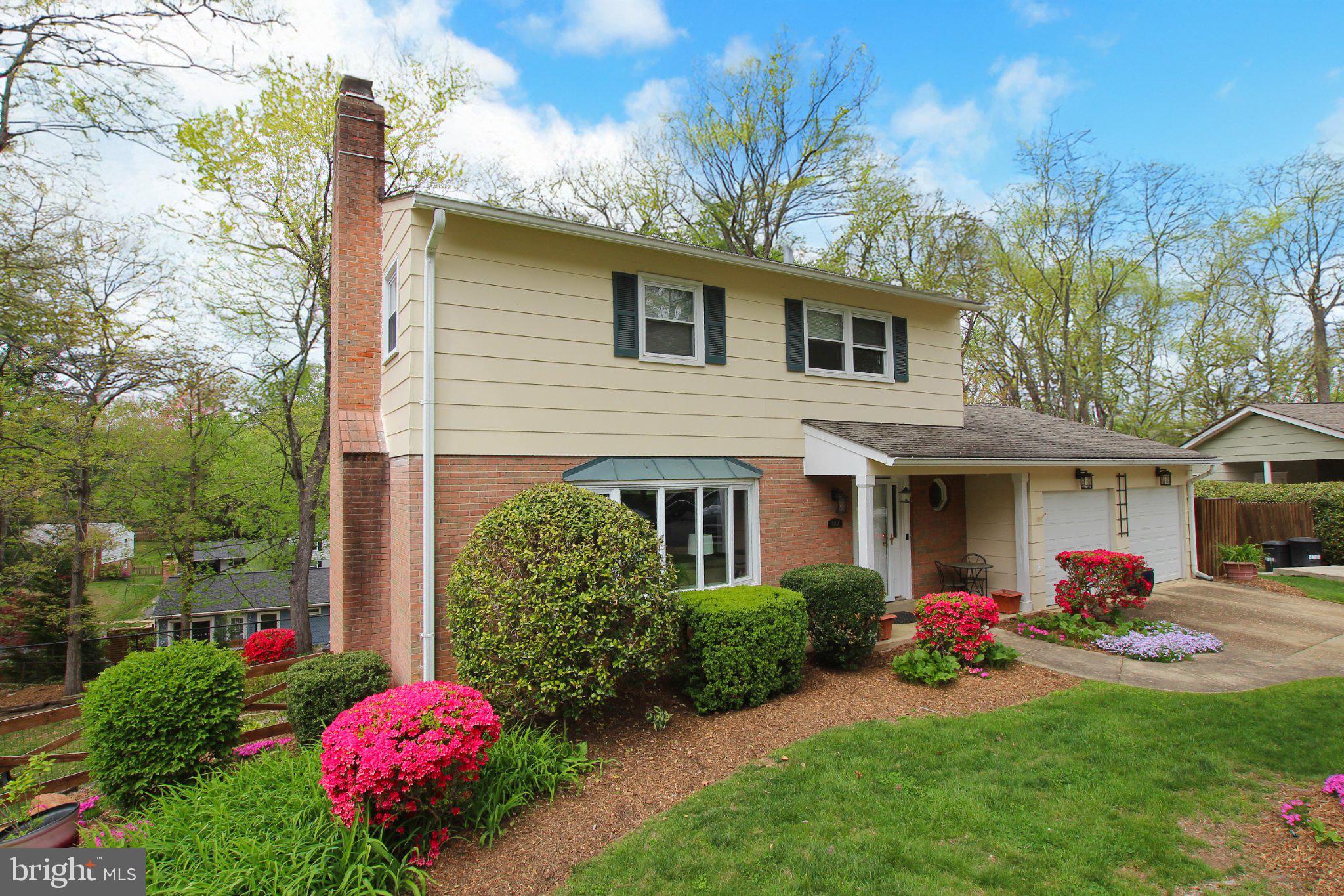 8502 Ivybridge Court Springfield, VA 22152 - Photo 31 of 31 a front view of a house with yard and a garden