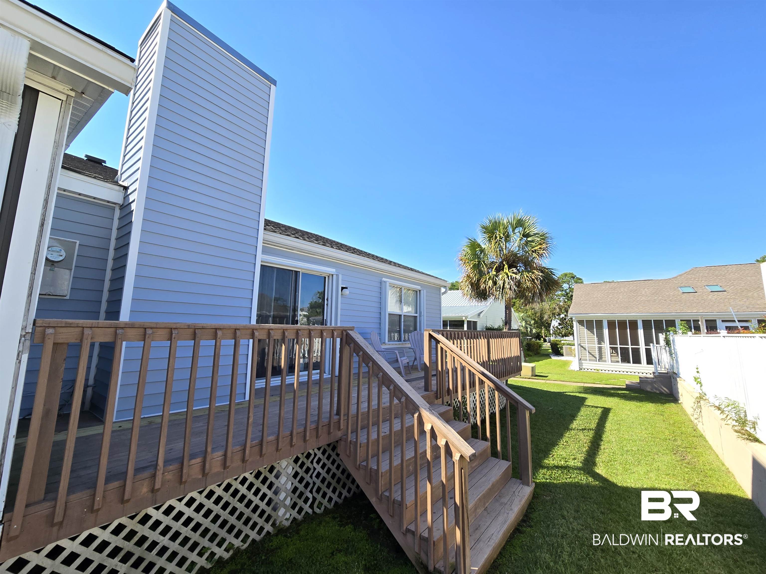3200 Loop Road, Unit 87 Orange Beach, AL 36561 - Photo 37 of 46 Deck featuring a lawn
