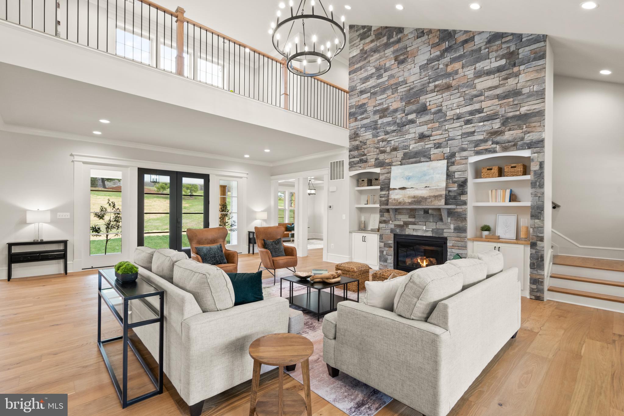 0 Greenwich Road Nokesville, VA 20181 - Photo 16 of 92 a living room with furniture a fireplace and a floor to ceiling window