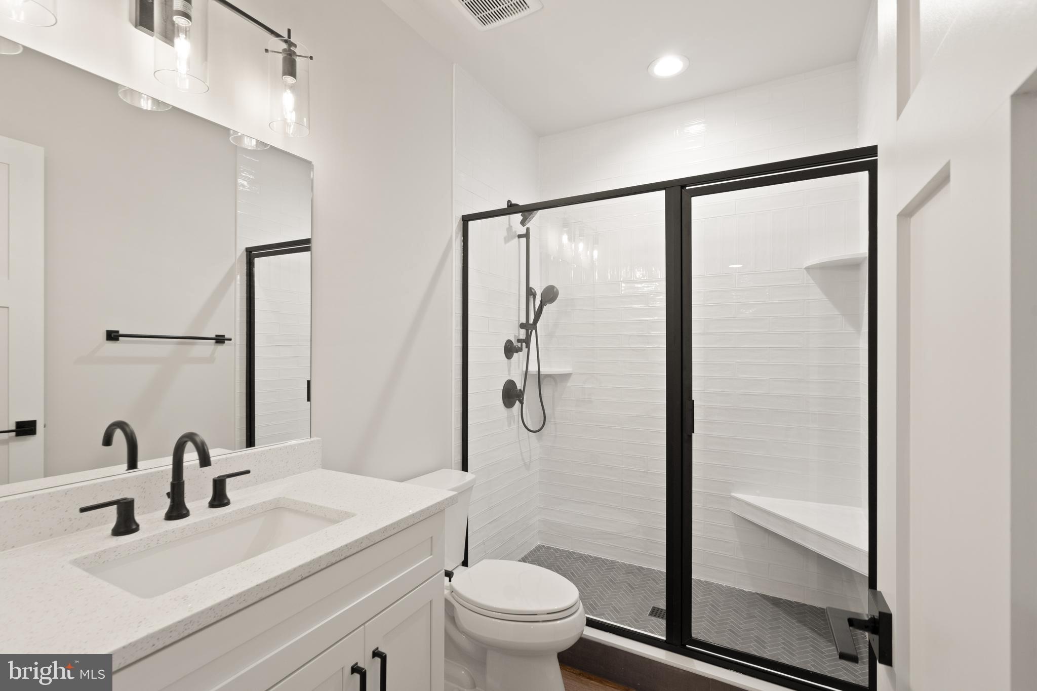 0 Greenwich Road Nokesville, VA 20181 - Photo 74 of 92 a bathroom with a shower sink vanity mirror and toilet