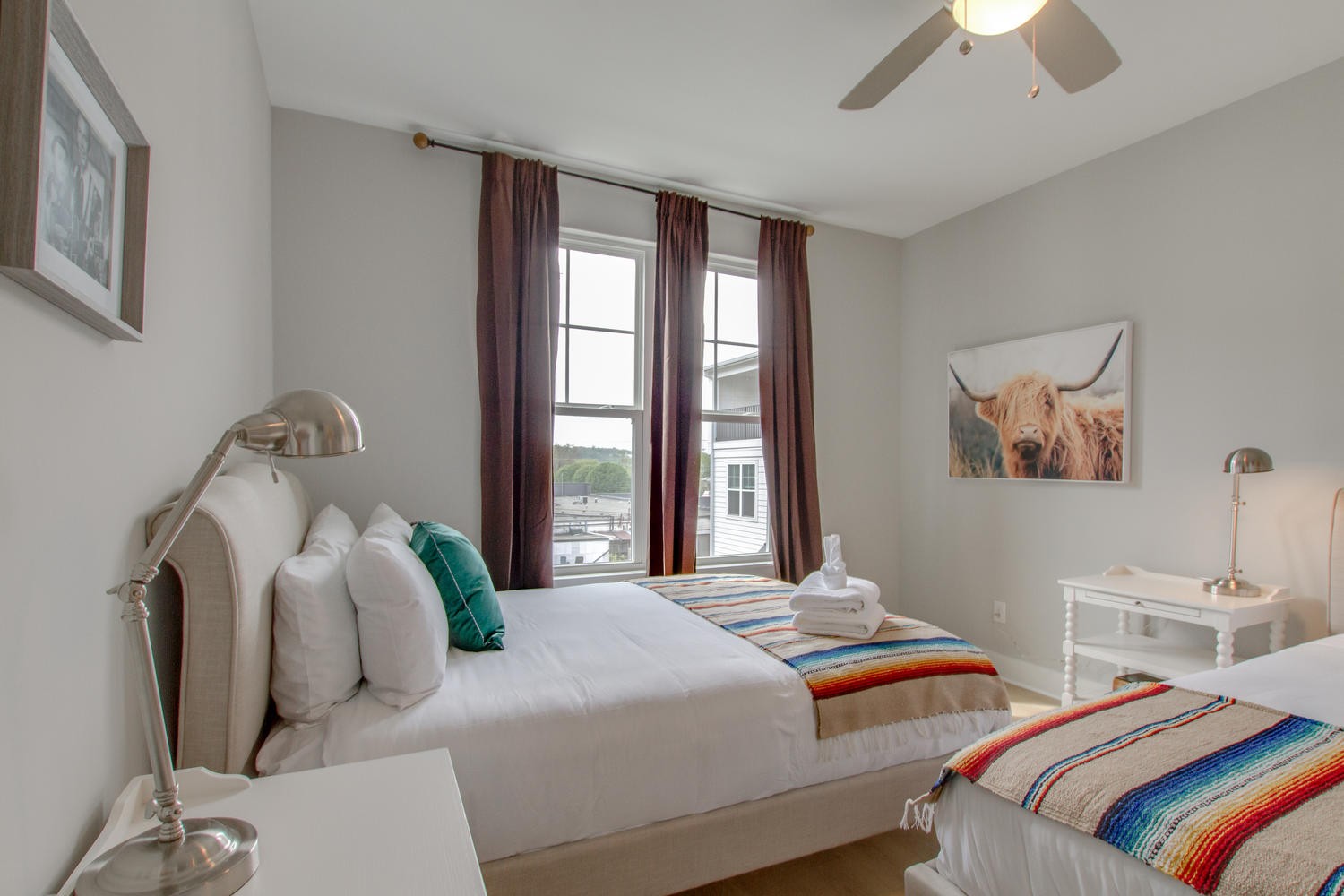 105 Duke Street, Unit 7 Nashville, TN 37207 - Photo 14 of 26 a bedroom with two beds and a chandelier