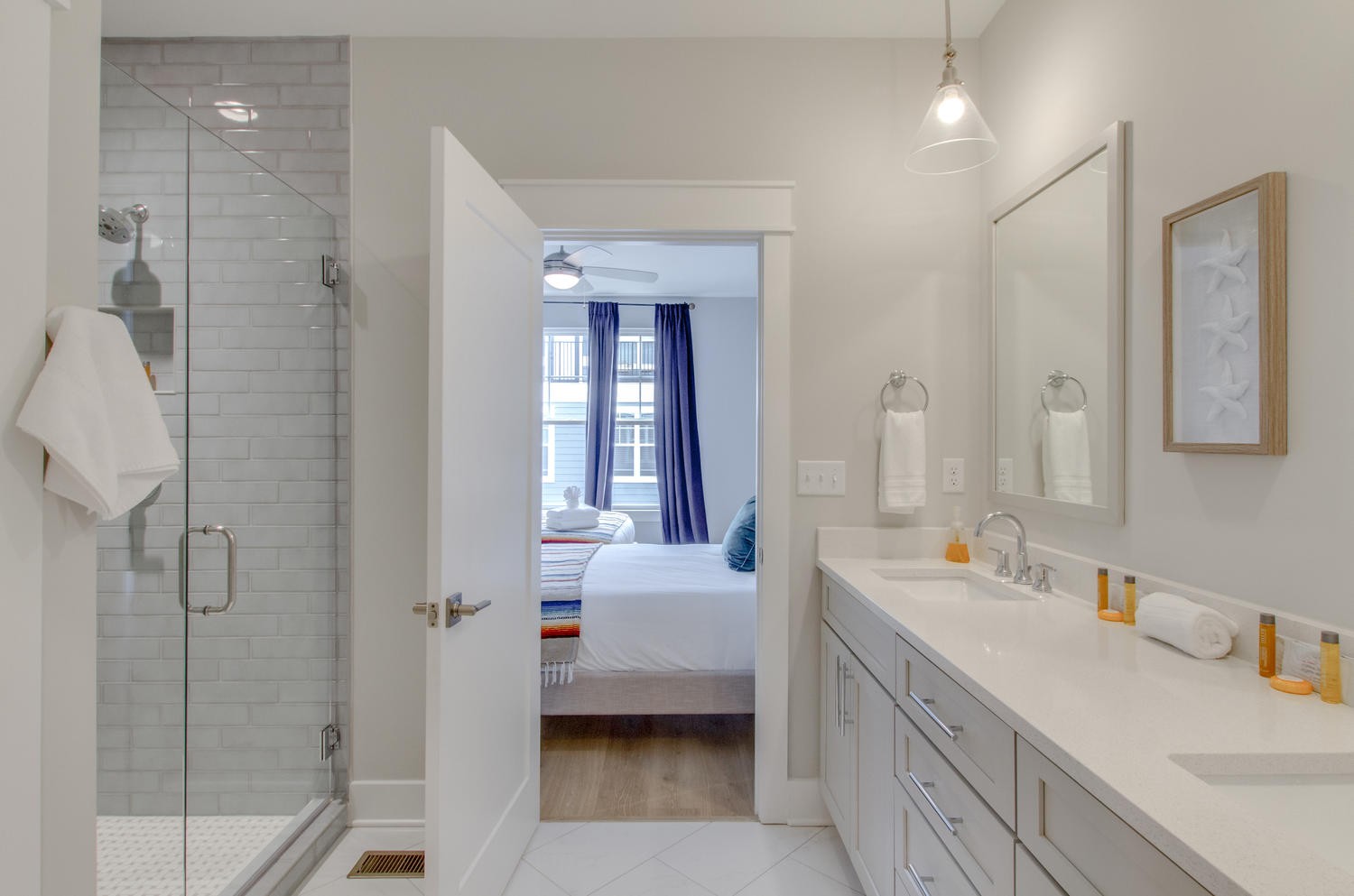 105 Duke Street, Unit 7 Nashville, TN 37207 - Photo 16 of 26 a en suite bathroom with a double vanity sink a mirror and shower