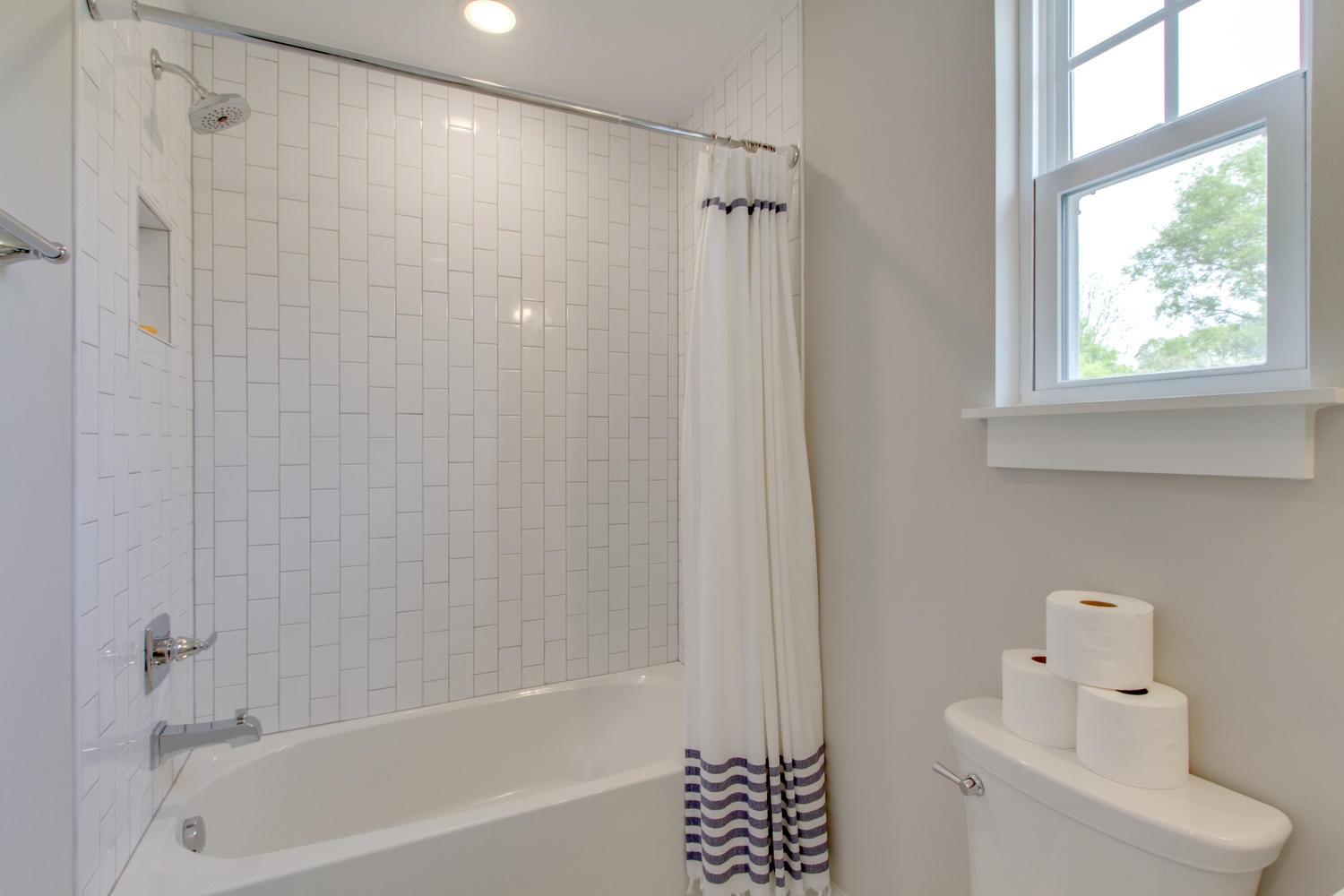 105 Duke Street, Unit 7 Nashville, TN 37207 - Photo 19 of 26 a bathroom with a bathtub a window and a shower