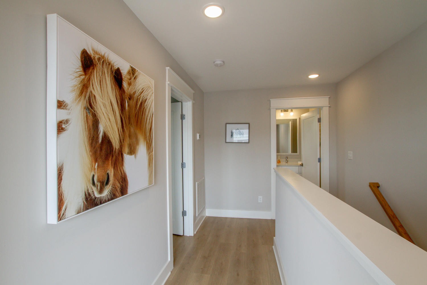 105 Duke Street, Unit 7 Nashville, TN 37207 - Photo 24 of 26 a view of a hallway with wooden floor and stairs