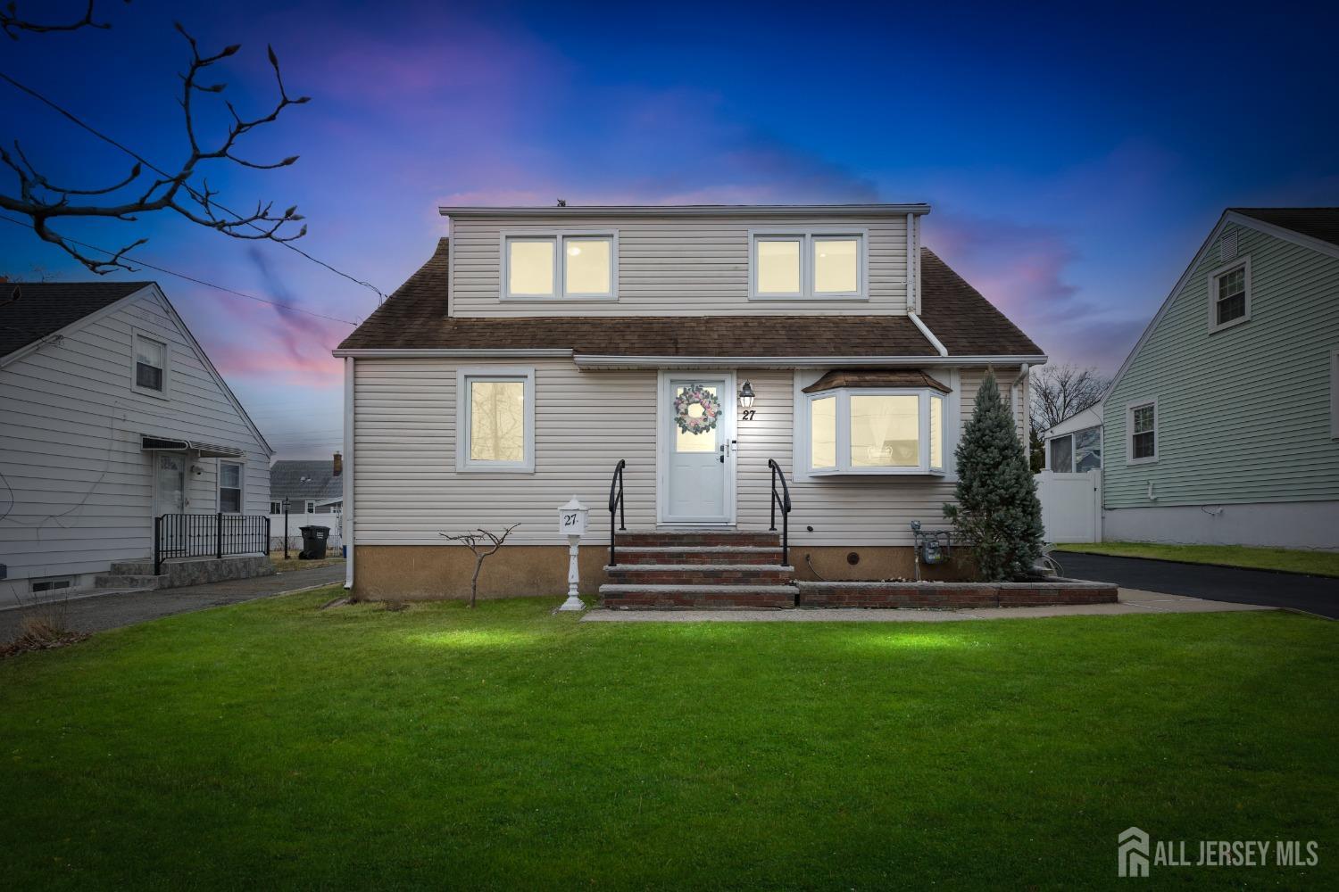 a front view of a house with a garden