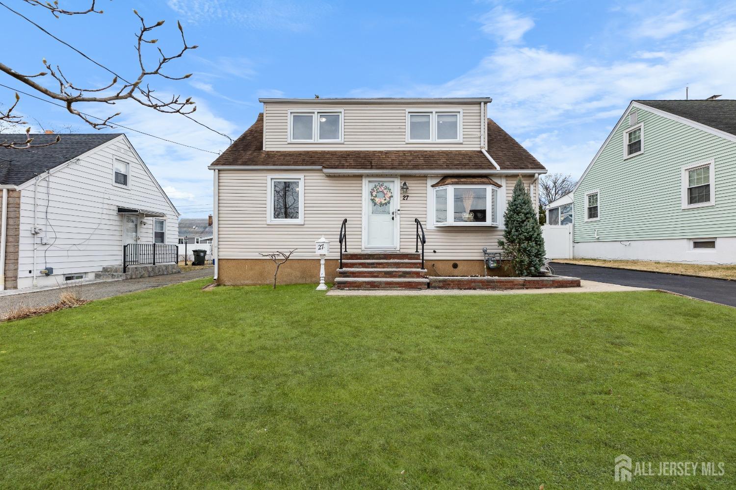 27 George Street Avenel, NJ 07001 - Photo 2 of 36 a front view of house with yard and outdoor seating