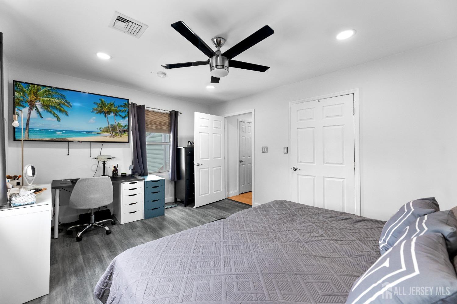 27 George Street Avenel, NJ 07001 - Photo 24 of 36 a bedroom with a bed and a desk